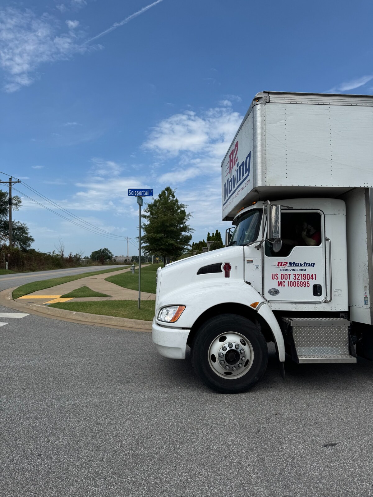 B2 Moving truck operating on Scissortail Drive during a Bentonville household move