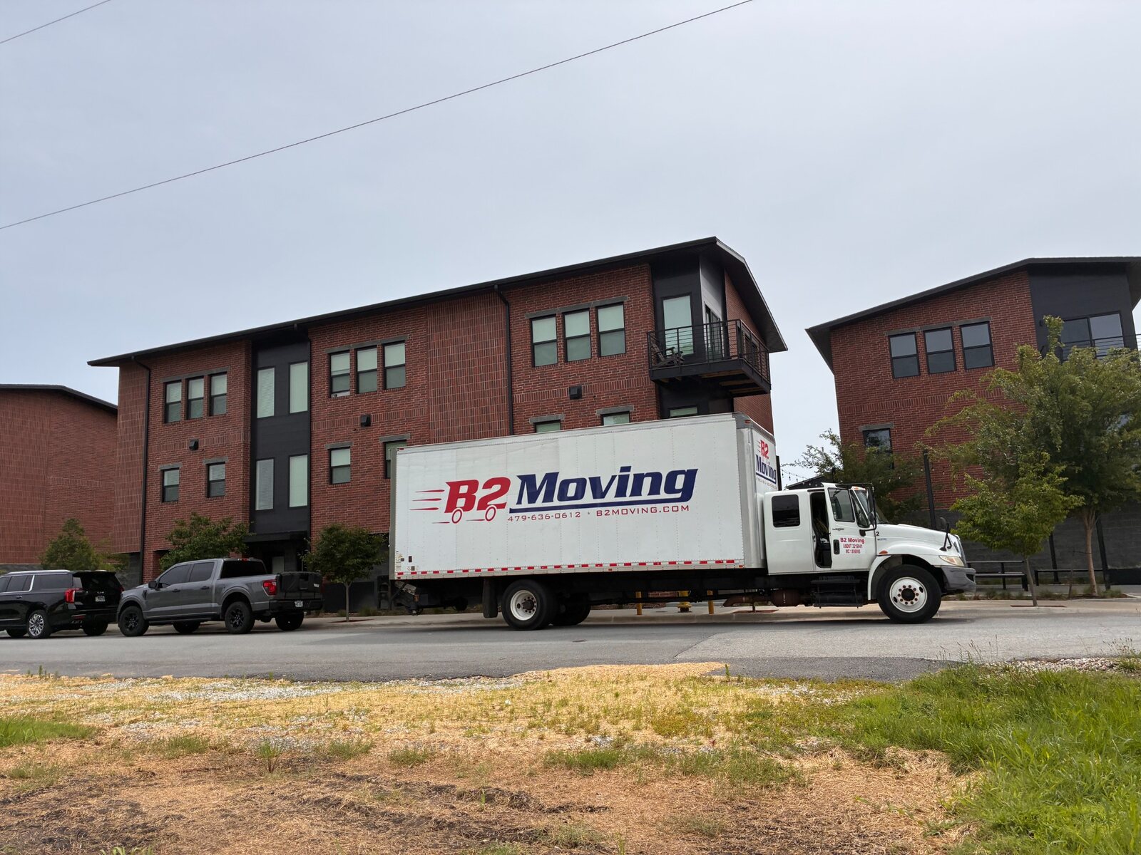 B2 Moving truck outside Bentonville townhomes for a local move to Rogers
