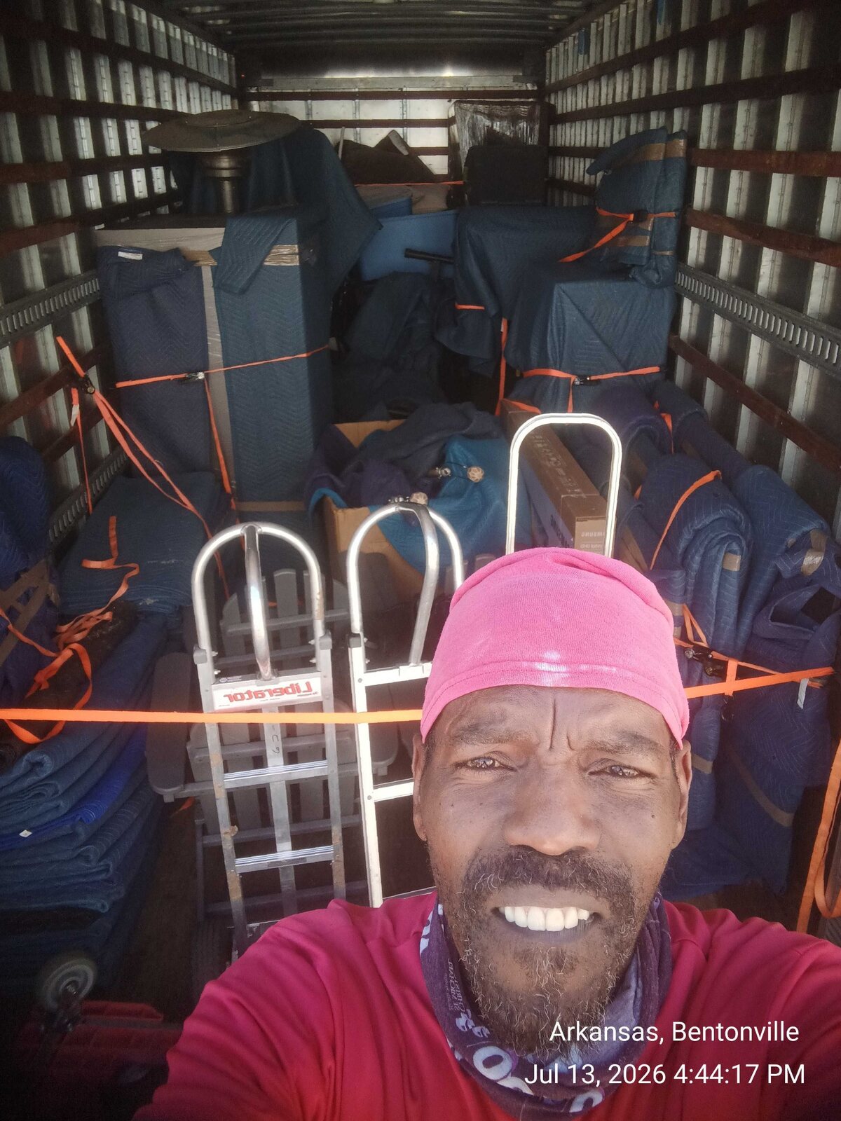 B2 mover Dolph documenting padded furniture secured inside a moving truck serving the Centerton area