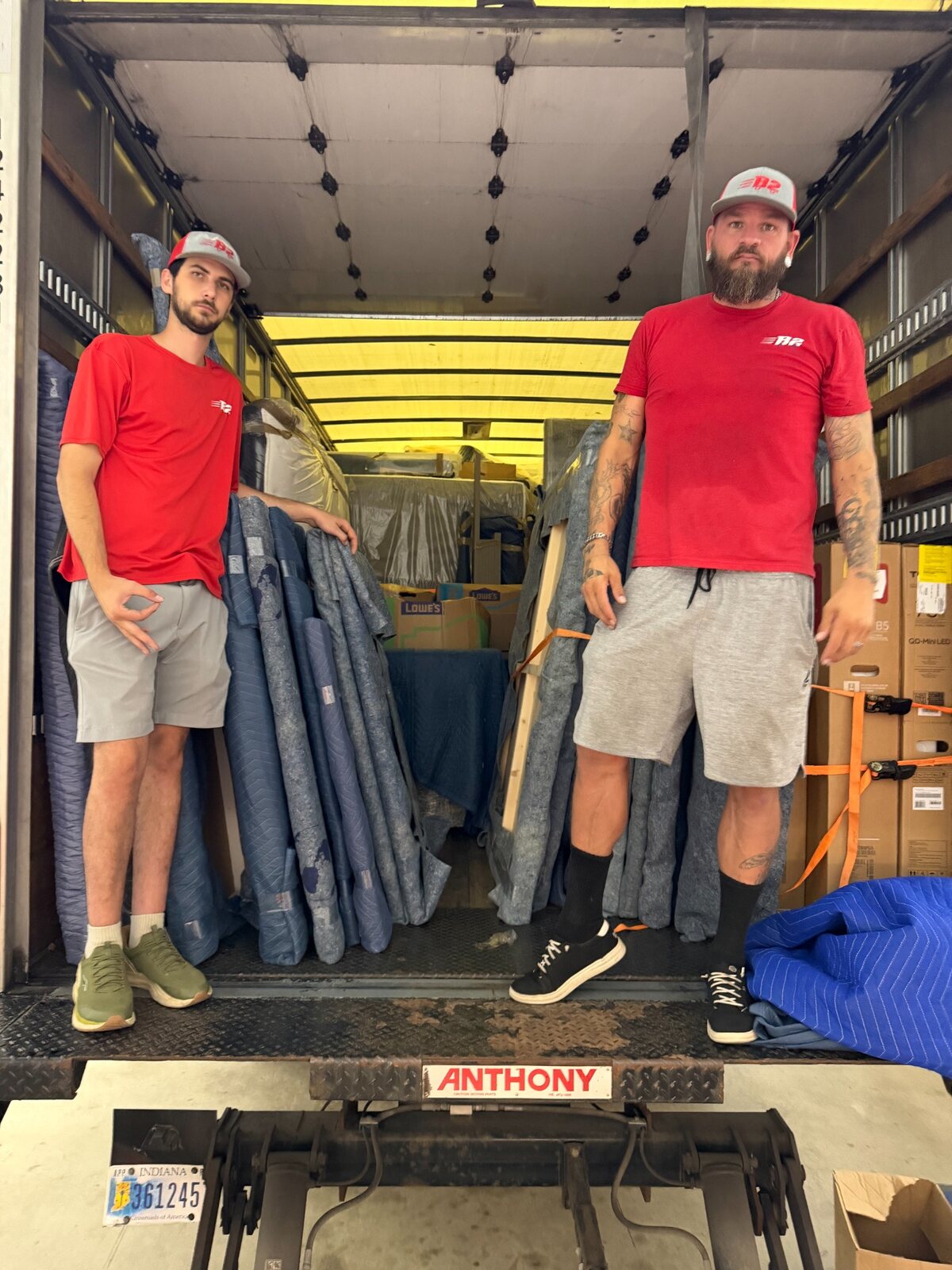 B2 mover Bradley and operations leader Chris Taylor working together inside a moving truck
