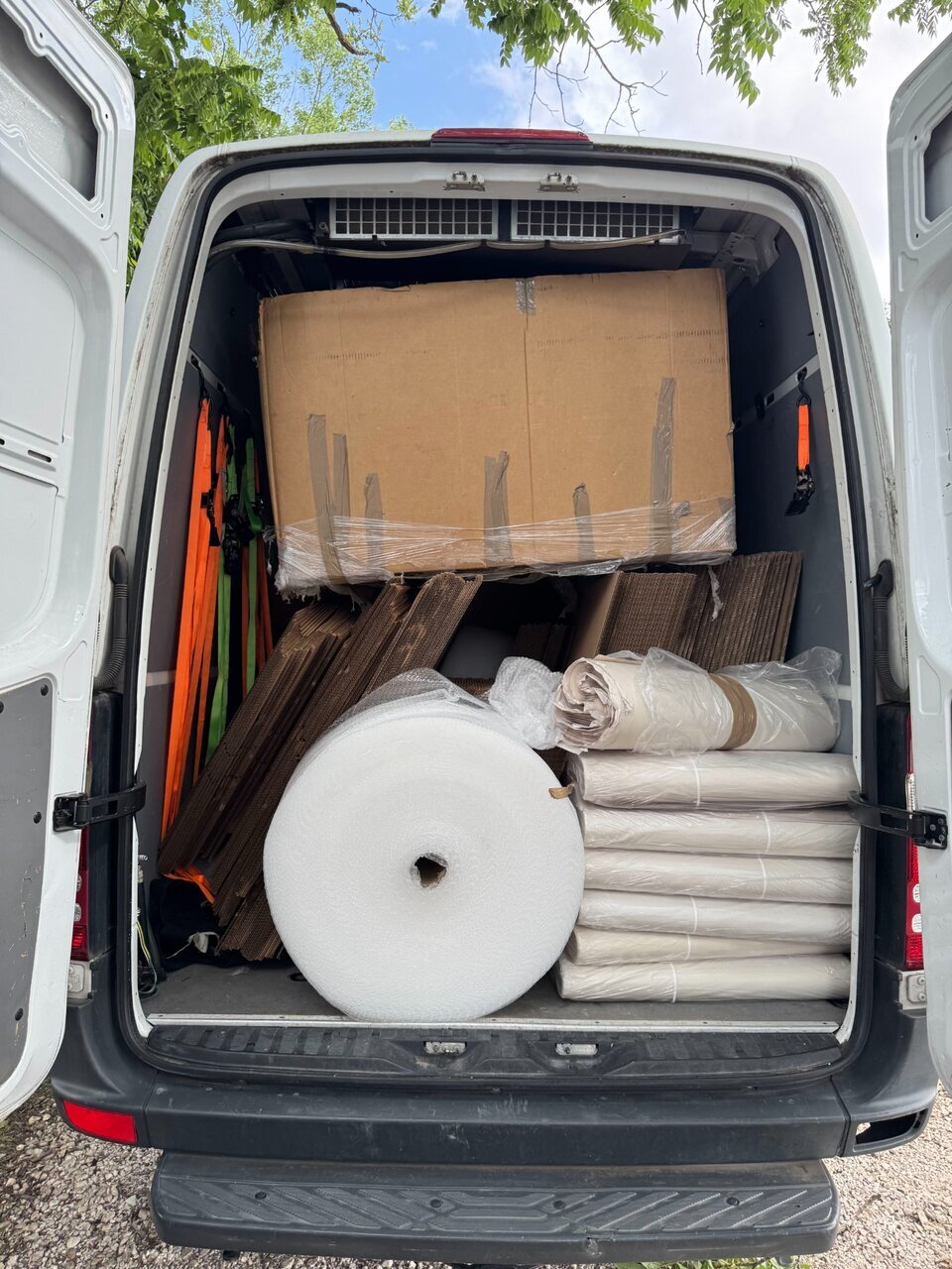Loaded B2 service van providing supplemental capacity and carrying moving materials for a Northwest Arkansas local move