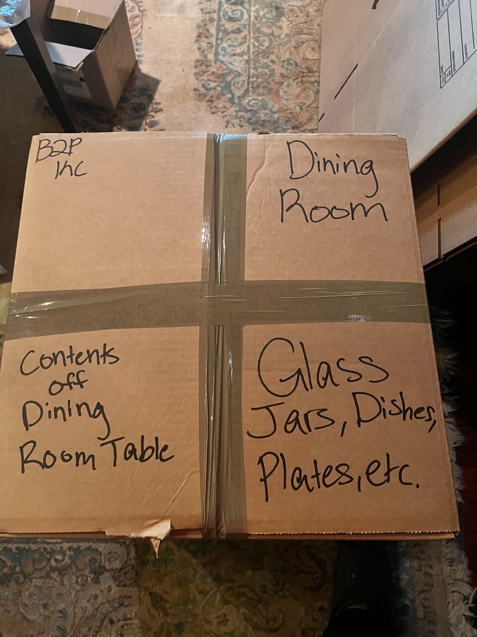 B2 packed box labeled by destination room and contents