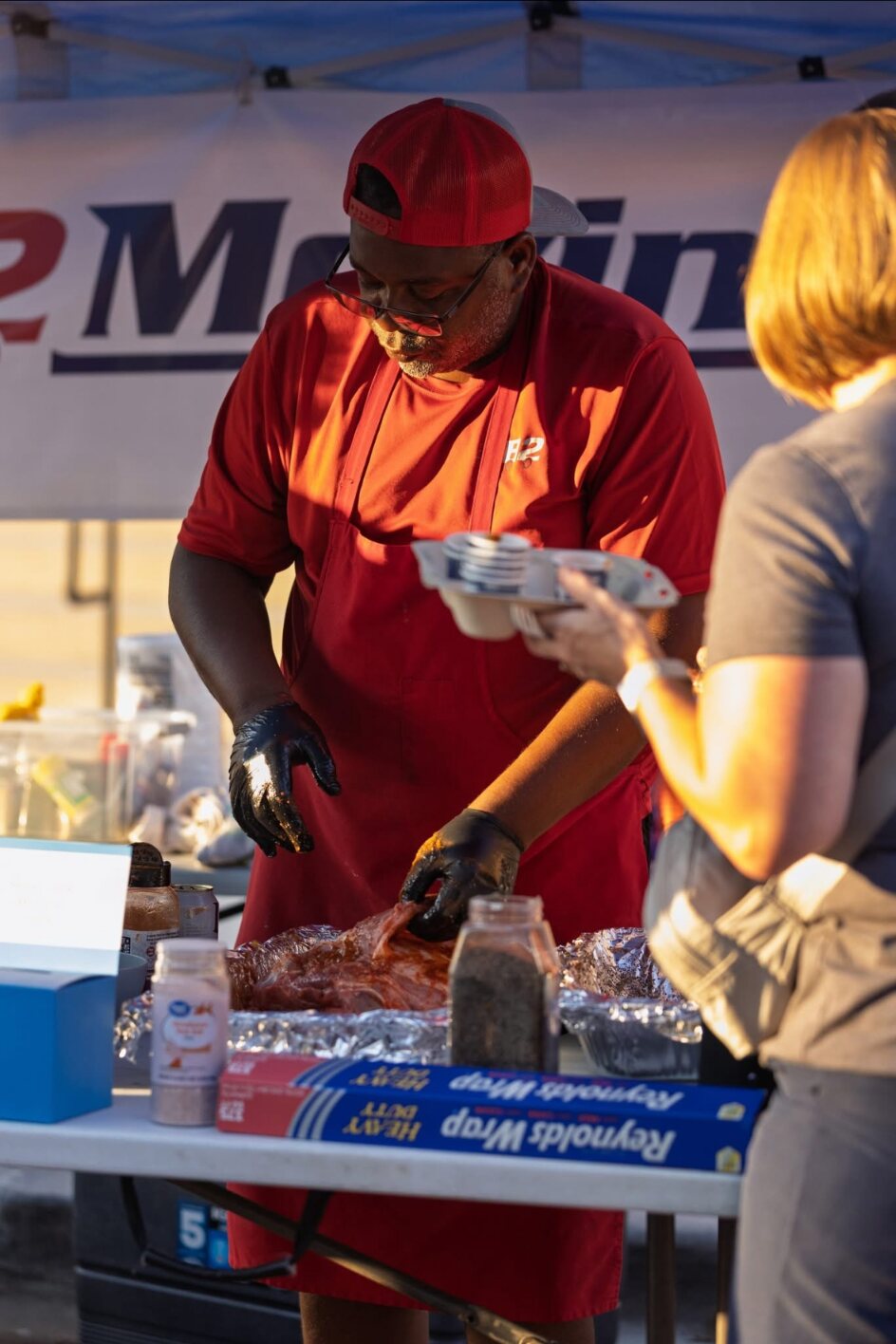 Jesse Bray preparing B2 Moving's turkey entry at the 2025 Frisco Inferno BBQ competition in Rogers