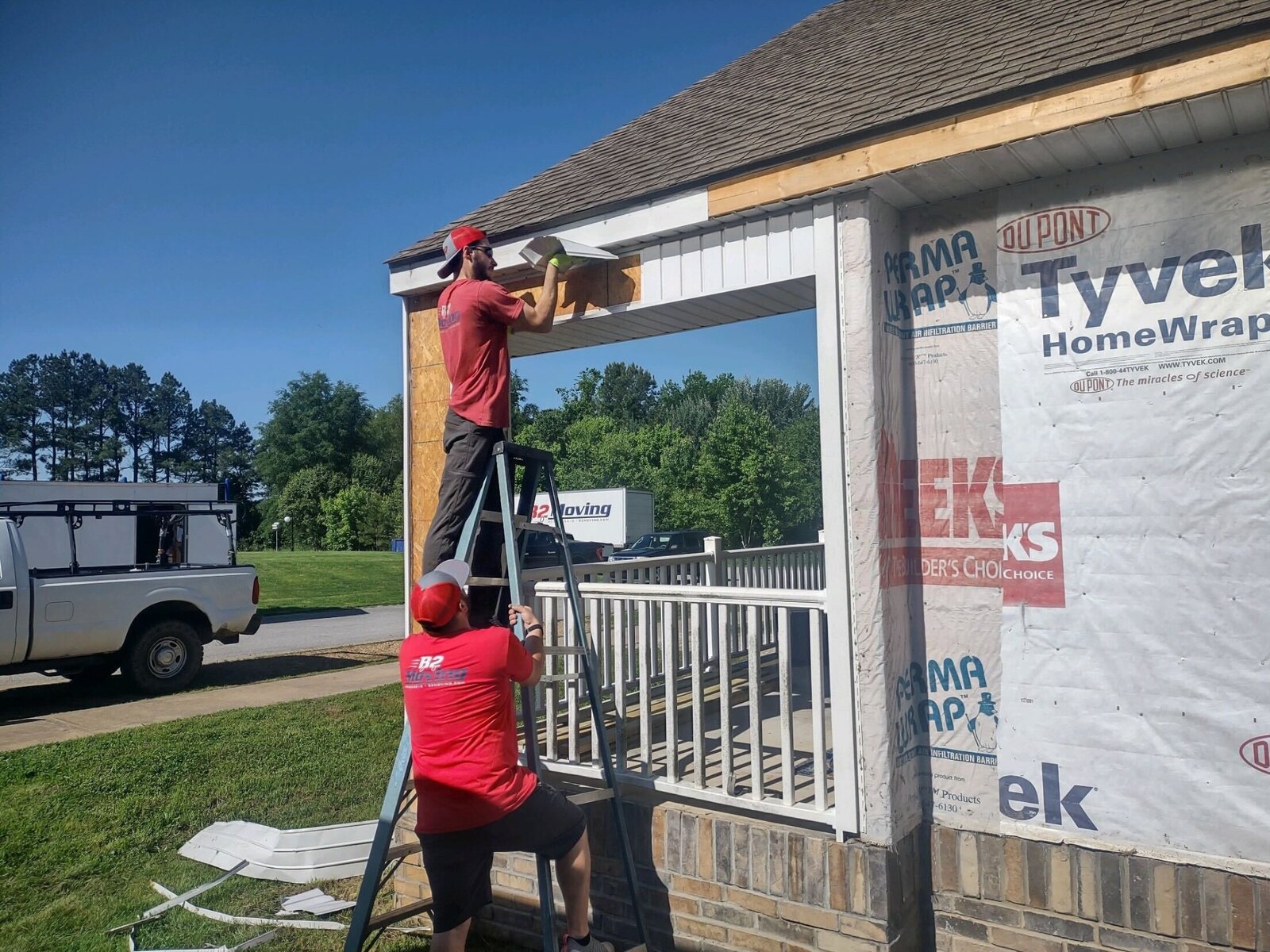 JT and B2 Moving teammates volunteering on a Habitat for Humanity project