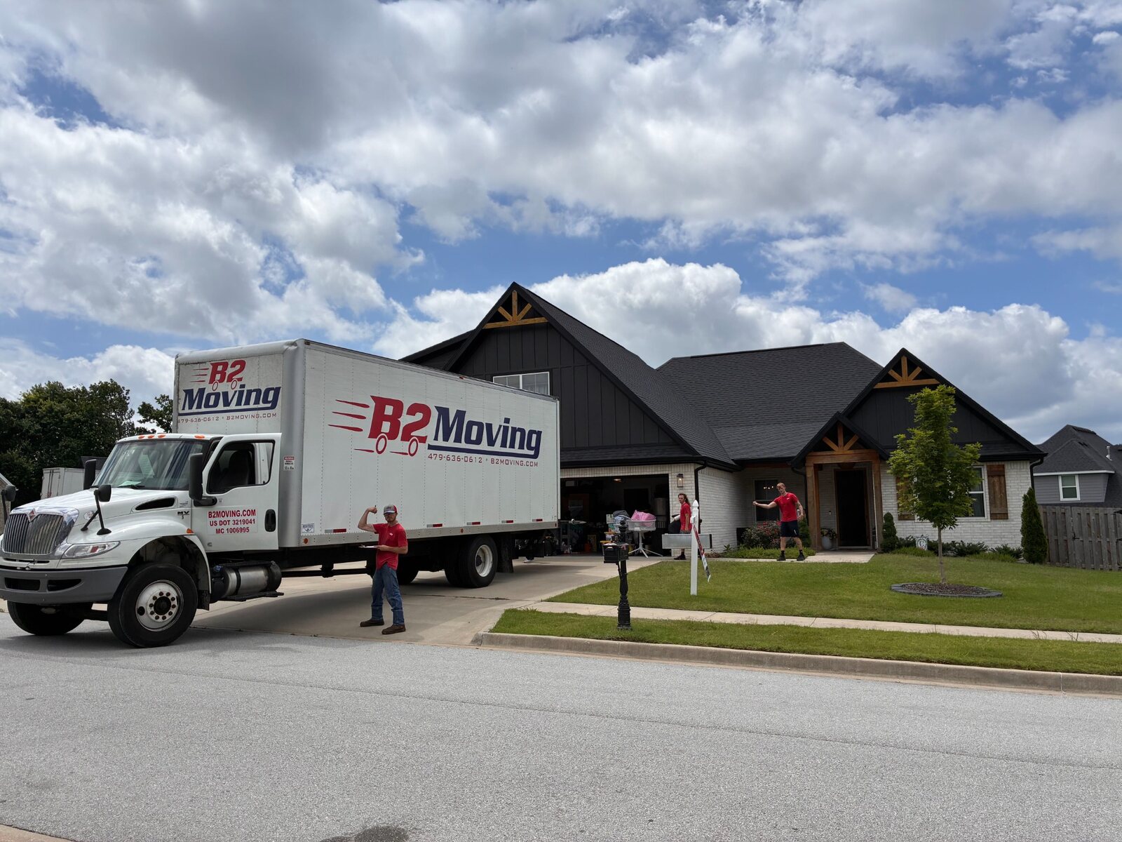 B2 moving truck and crew beginning a Springdale-to-Elm Springs move after the customer walkthrough